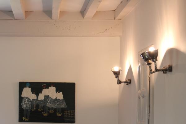 Beautiful Double wall lamps that illuminate the room very well, and practical because we can direct the light the way we want!