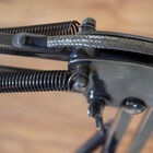 Detail of mechanism and braided cable in indus fashion.