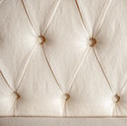 The Montaigu bench is upholstered up to the top of its superb flared side structures