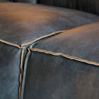 Inverted seams, and rich leather tones.