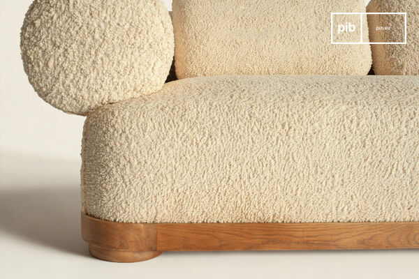 Its solid oak base encircles a deep seat, designed to envelop and provide lasting support