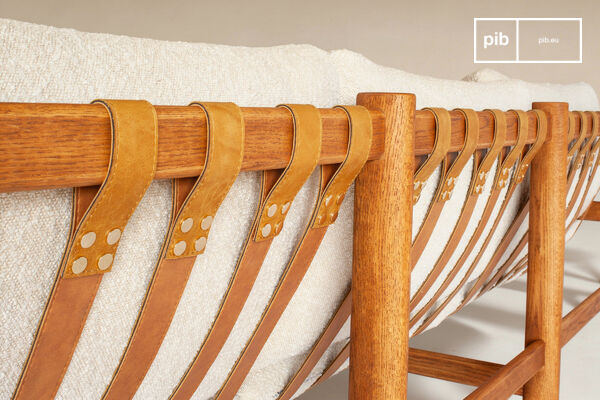 Comfort is provided by a traditional suspension system composed of cognac-colored leather straps