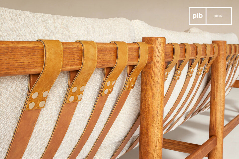 Comfort is provided by a traditional suspension system composed of cognac-colored leather straps