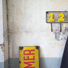 Vintage mesh coat rack with numbered hooks.