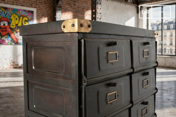 Each corner is reinforced with a brass bracket to protect the cabinet from impact