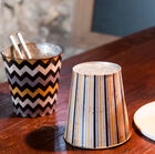 An aged effect adds a worn side to the pot covers.