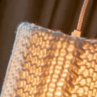Thanks to the knitting the lamp diffuses a soft light.