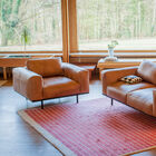 Combine armchair and sofa for a stylish lounge.