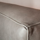 The grey is very slightly shaded and the leather is of a rare quality.
