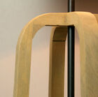 The four legs gather around a black metal rod.