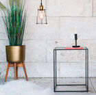 A small table with pure and original geometric lines.