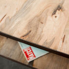 Skilful combination of solid wood and steel strapping.