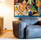 A massive armchair, soft, and full of character.