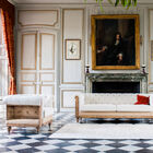 The white and brown armchair has a very elegant contrast.