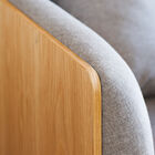 The wooden chest is married by generous cushions.