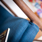 The solid wood structure and the blue fabric blend together elegantly.