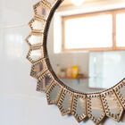 Charming and unusual brass sunglass mirror.