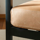 Beautiful matt black metal structure and light brown leather seat.