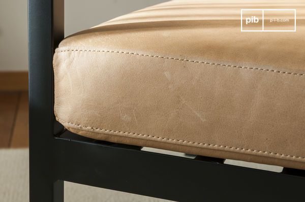 Beautiful matt black metal structure and light brown leather seat.