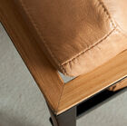 Top of the light wood frame almost merging with the leather.