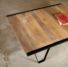 The lateral structure is present on only 2 sides of the table.