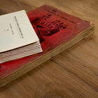 The solid teak top recalls the old warehouse pallets.