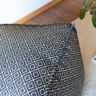 Weaving that is found all along the footstool, up to the edges.