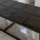 Its 150 cm size and checkered top create a strong visual anchor point in the living room