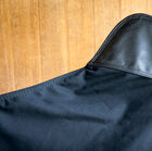 The canvas is adorned with four corners made of pretty black leather.