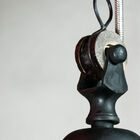 Luminaire suspended by a chain with adjustable length.