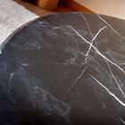 The marble top is a pretty black with a white veining.