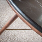Black marble top on a walnut structure.