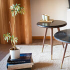 The Sivärt black marble sofa end table will find its place in a living room