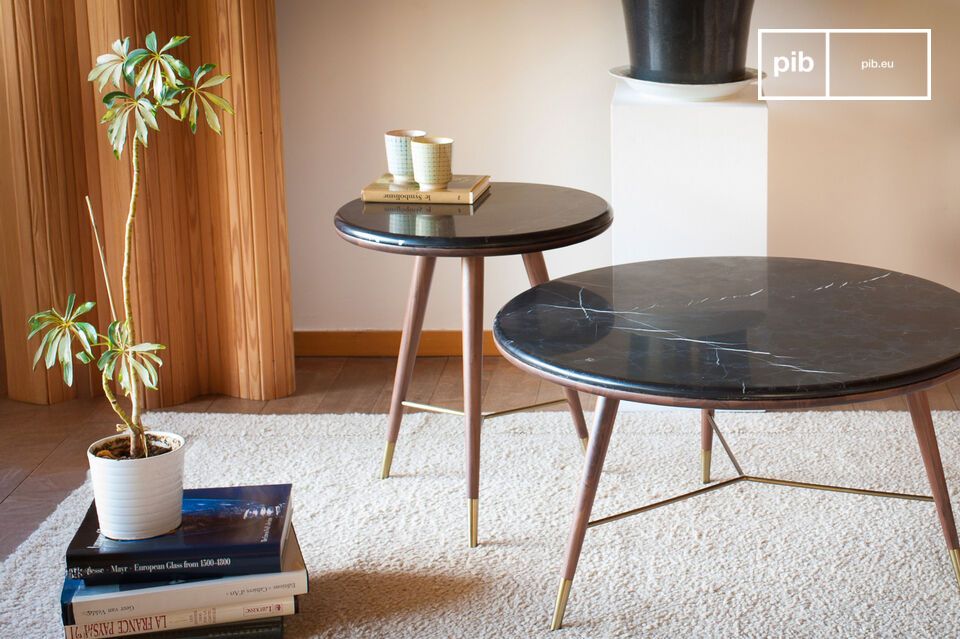 The Sivärt black marble sofa end table will find its place in a living room