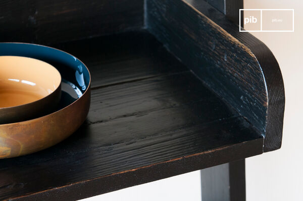 A library highlighting the charm of recycled old wood: the black wooden large scale bookcase is made