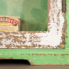 The floral pattern of the wallpaper back to these rustic shelves and its hand-distressed paint