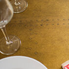 The table top is made out of oak wood covered with a thick lacquered brass and stud with nails