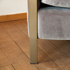 The base is made of gilded metal with a black skate on the tip of the foot.