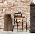 Very dark brown, almost black metal furniture.