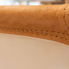 The back is lined with a pretty textured fabric in ivory white color.