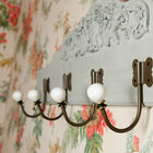 Five beautiful hooks firmly fixed with four screws.