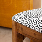 Enjoy its angular lines and the retro patterns of the fabric of the seat