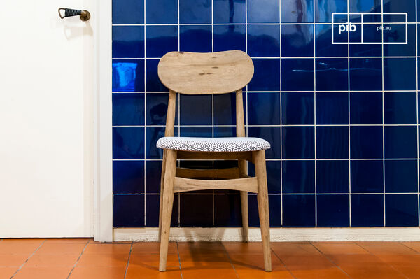 The chair has a beautiful patina finish.