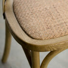 Comfortable seat upholstered in cane.