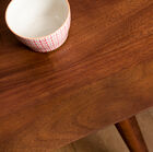 The top is protected by a varnish that makes the table resistant.