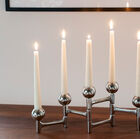 The candlestick can be positioned as you wish.
