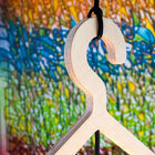 The wooden structure is in the shape of a hanger.