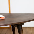 Raw wooden tray covered with a dark varnish.