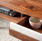 The table has two practical drawers.