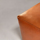 The thick cylindrical legs cross the frame and ensure lasting stability